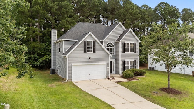 204 Trevor Ridge Dr, Holly Springs, NC 27540 - traditional home featuring a chimney, driveway, a garage, a front yard, and roof with shingles