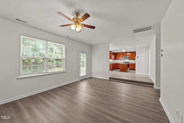 204 Trevor Ridge Dr, Holly Springs, NC 27540 - unfurnished living room with dark wood-type flooring and a ceiling fan