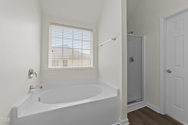 204 Trevor Ridge Dr, Holly Springs, NC 27540 - bathroom with a garden tub, a stall shower, and wood finished floors