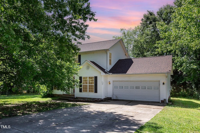 105 Hiddenwood Ct, Garner, NC 27529 - traditional-style house featuring driveway, a garage, a lawn, and roof with shingles