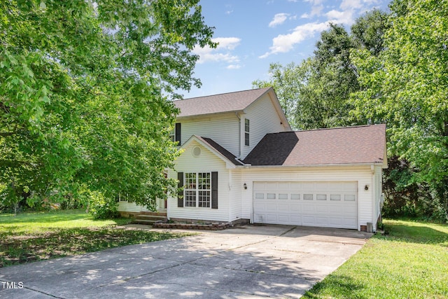 105 Hiddenwood Ct, Garner, NC 27529 - traditional home with driveway, a garage, a front lawn, and roof with shingles