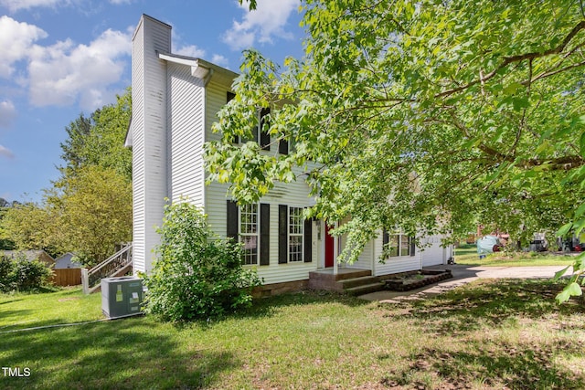 105 Hiddenwood Ct, Garner, NC 27529 - view of property exterior with a chimney, crawl space, and central AC