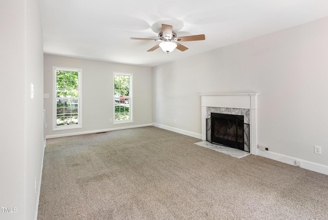 105 Hiddenwood Ct, Garner, NC 27529 - unfurnished living room featuring carpet flooring, a ceiling fan, a fireplace, and baseboards