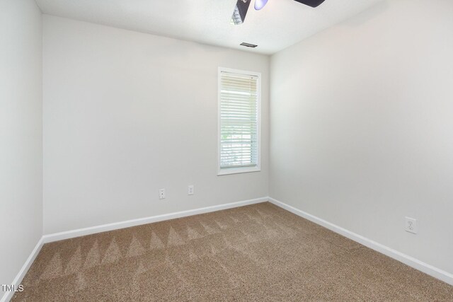 105 Hiddenwood Ct, Garner, NC 27529 - empty room featuring carpet flooring, a ceiling fan, and baseboards