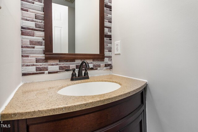 105 Hiddenwood Ct, Garner, NC 27529 - bathroom with vanity and tasteful backsplash