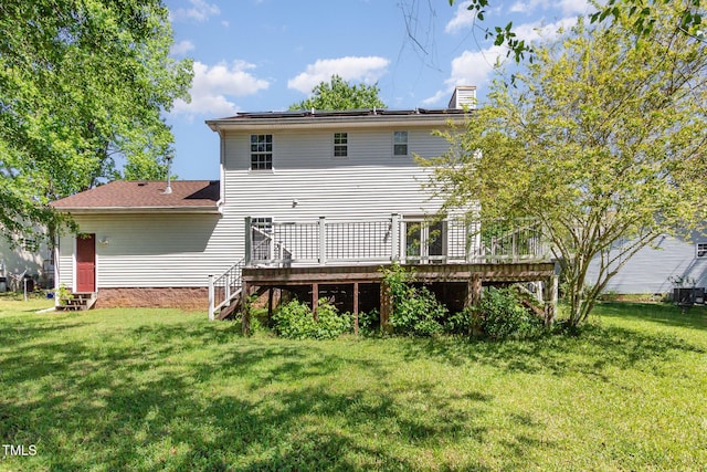 105 Hiddenwood Ct, Garner, NC 27529 - rear view of house featuring a deck, a yard, and cooling unit