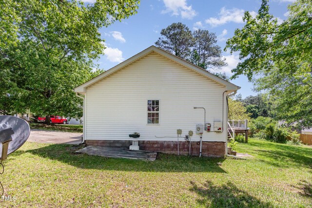 105 Hiddenwood Ct, Garner, NC 27529 - rear view of house with a yard