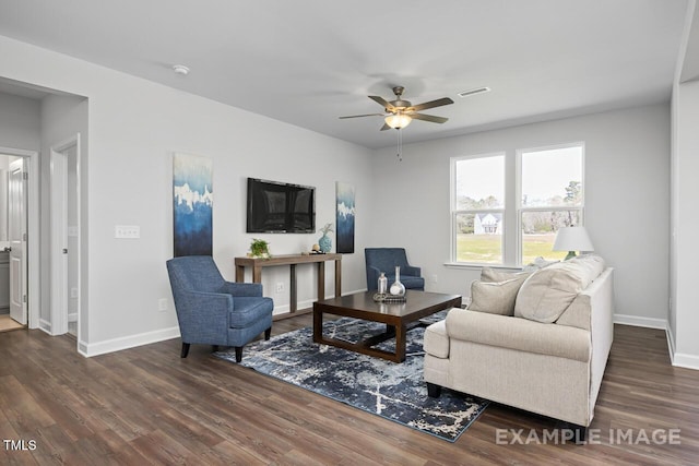 1412 Main St, Lillington, NC 27546 - living area with a ceiling fan, dark wood-style flooring, and baseboards