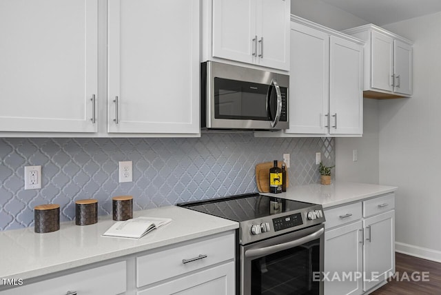 1412 Main St, Lillington, NC 27546 - kitchen with stainless steel appliances, light countertops, white cabinetry, and tasteful backsplash
