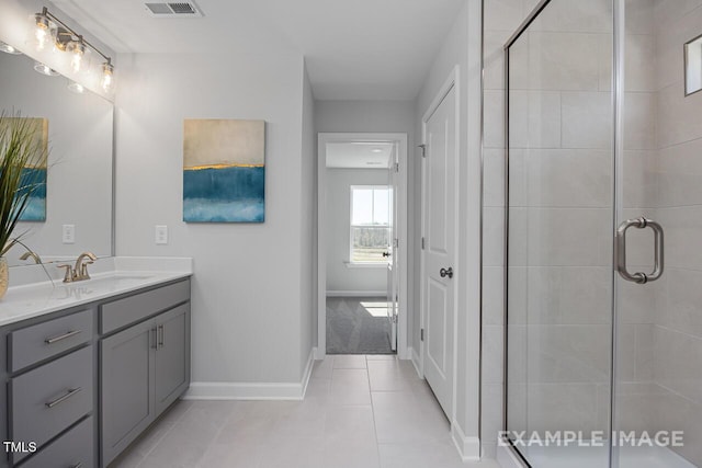 1412 Main St, Lillington, NC 27546 - full bath featuring a shower stall, vanity, tile patterned floors, and baseboards