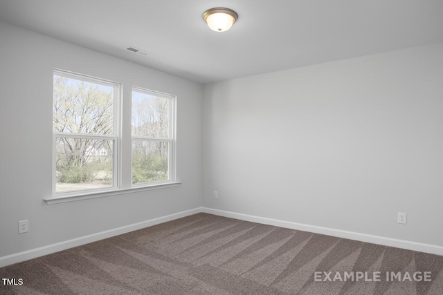 1412 Main St, Lillington, NC 27546 - spare room with healthy amount of natural light, baseboards, and dark carpet