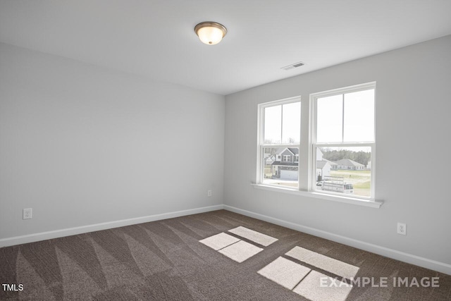 1412 Main St, Lillington, NC 27546 - carpeted empty room featuring baseboards