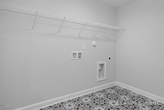 1412 Main St, Lillington, NC 27546 - washroom featuring hookup for an electric dryer, baseboards, hookup for a washing machine, gas dryer hookup, and tile patterned floors