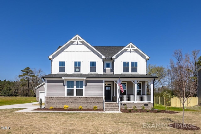 1412 Main St, Lillington, NC 27546 - view of front of home featuring a porch, board and batten siding, a front lawn, brick siding, and concrete driveway