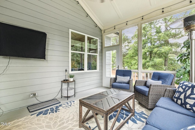 sunroom / solarium with an outdoor hangout area, lofted ceiling, and plenty of natural light