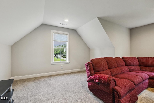living room featuring carpet floors, vaulted ceiling, and baseboards