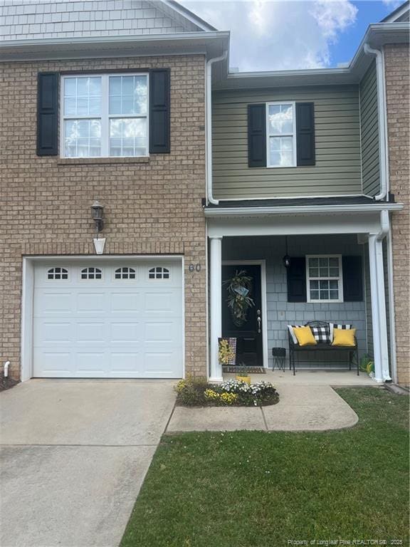 60 Hill Shore Ln, Clayton, NC 27527 - view of front of house with a garage, driveway, and a porch