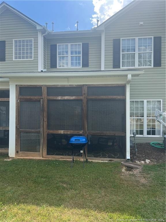60 Hill Shore Ln, Clayton, NC 27527 - view of side of home with a lawn and a sunroom