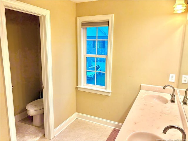 60 Hill Shore Ln, Clayton, NC 27527 - bathroom with tile patterned flooring, toilet, baseboards, and double vanity