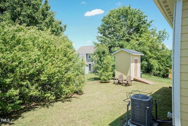 116 Laurel Ave, Durham, NC 27701 - view of grassy yard with a shed, cooling unit, and an outbuilding
