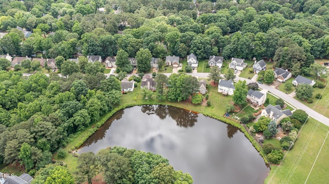 aerial view of residential area featuring a large body of water