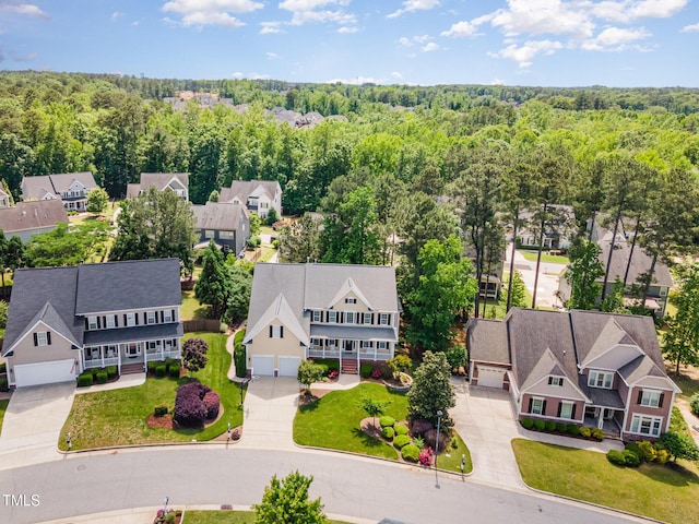 aerial perspective of suburban area featuring a forest