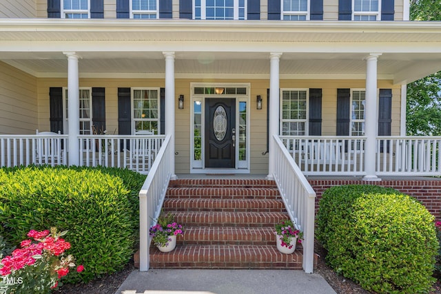 doorway to property with a porch