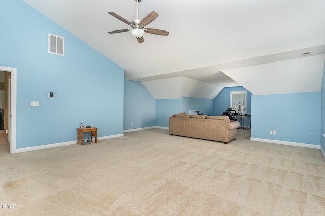 living area featuring lofted ceiling, light colored carpet, a ceiling fan, and baseboards