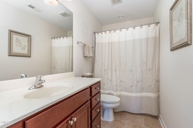 bathroom featuring toilet, tile patterned floors, and vanity