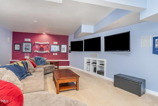 carpeted living room featuring baseboards and built in features