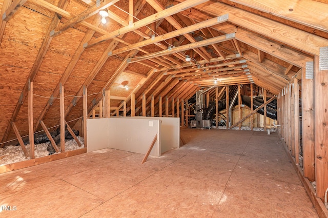 attic featuring an upstairs landing