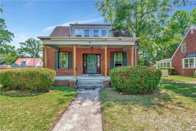 201 W 16th St, Lumberton, NC 28358 - bungalow-style house with brick siding, a porch, and a front lawn