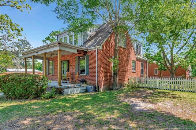 201 W 16th St, Lumberton, NC 28358 - view of front of home with brick siding, a ceiling fan, and covered porch