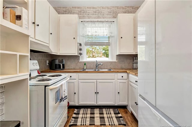201 W 16th St, Lumberton, NC 28358 - kitchen featuring white appliances, a sink, under cabinet range hood, white cabinetry, and backsplash