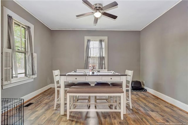 201 W 16th St, Lumberton, NC 28358 - dining room featuring plenty of natural light, baseboards, ceiling fan, and ornamental molding