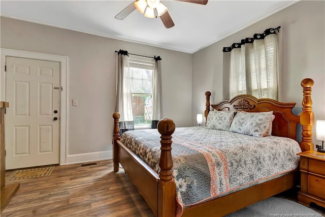 201 W 16th St, Lumberton, NC 28358 - bedroom with wood finished floors, baseboards, and ceiling fan
