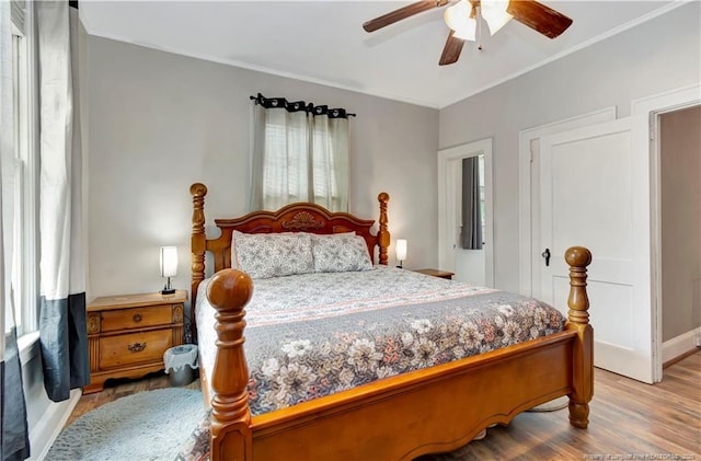 201 W 16th St, Lumberton, NC 28358 - bedroom with wood finished floors, a ceiling fan, crown molding, and baseboards