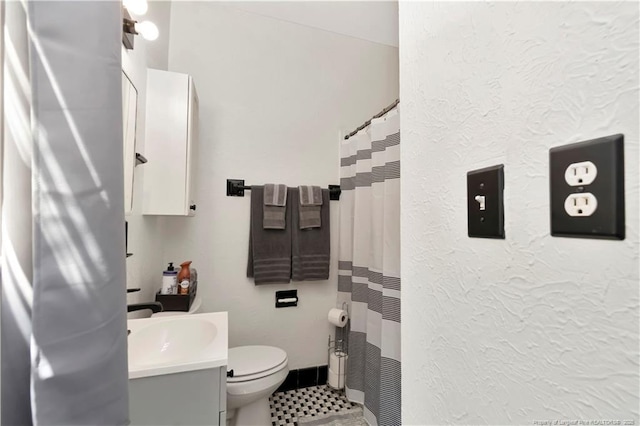 201 W 16th St, Lumberton, NC 28358 - full bathroom with vanity, toilet, tile patterned floors, a textured wall, and curtained shower