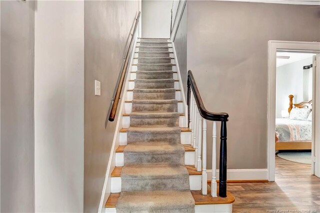 201 W 16th St, Lumberton, NC 28358 - staircase featuring wood finished floors and baseboards