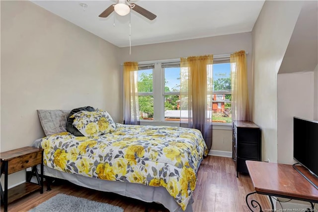 201 W 16th St, Lumberton, NC 28358 - bedroom with wood finished floors, baseboards, and ceiling fan