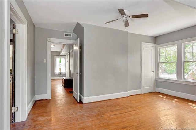 201 W 16th St, Lumberton, NC 28358 - unfurnished room with baseboards, light wood-type flooring, and a ceiling fan