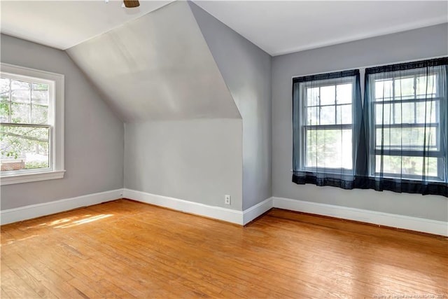 201 W 16th St, Lumberton, NC 28358 - additional living space with light wood-style floors, baseboards, and lofted ceiling