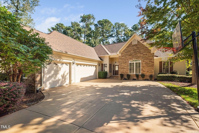 39 Forked Pine Ct, Chapel Hill, NC 27517 - view of front of home featuring driveway, an attached garage, a shingled roof, and brick siding