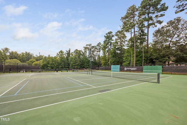39 Forked Pine Ct, Chapel Hill, NC 27517 - view of tennis court with fence, community basketball court, and view of wooded area