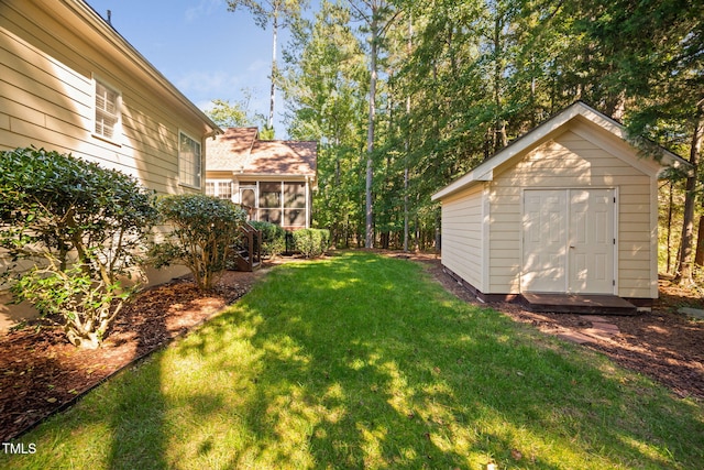 39 Forked Pine Ct, Chapel Hill, NC 27517 - view of green lawn with a shed, an outdoor structure, and a sunroom