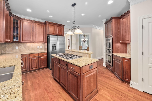 39 Forked Pine Ct, Chapel Hill, NC 27517 - kitchen featuring stainless steel appliances, a kitchen island, tasteful backsplash, crown molding, and light wood-style flooring