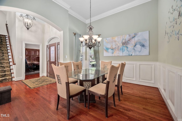 39 Forked Pine Ct, Chapel Hill, NC 27517 - dining space with a chandelier, stairway, ornamental molding, arched walkways, and wood finished floors