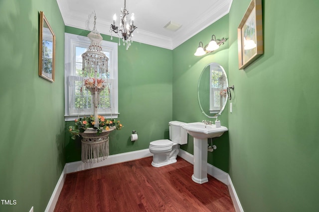 39 Forked Pine Ct, Chapel Hill, NC 27517 - half bathroom featuring a chandelier, baseboards, toilet, crown molding, and wood finished floors