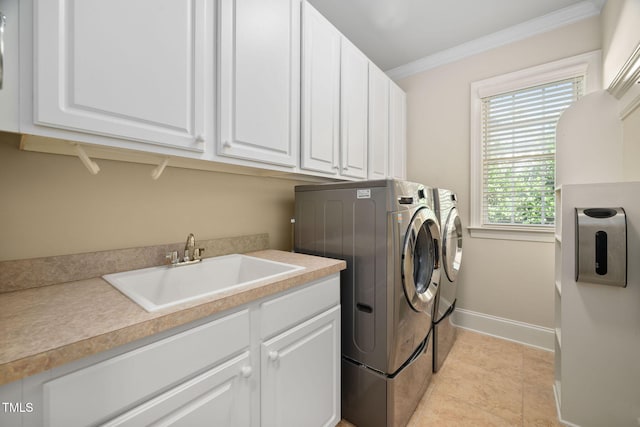 39 Forked Pine Ct, Chapel Hill, NC 27517 - laundry room with washing machine and clothes dryer, ornamental molding, cabinet space, baseboards, and light tile patterned floors