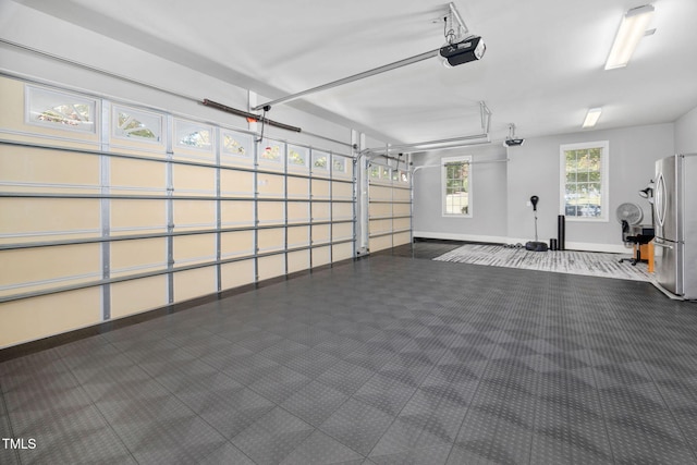 39 Forked Pine Ct, Chapel Hill, NC 27517 - garage featuring freestanding refrigerator, a garage door opener, and baseboards